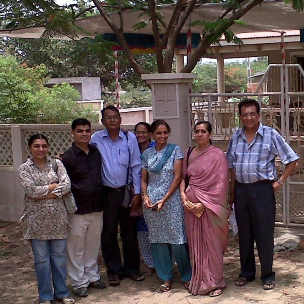 A group of people standing in front of a clinic
